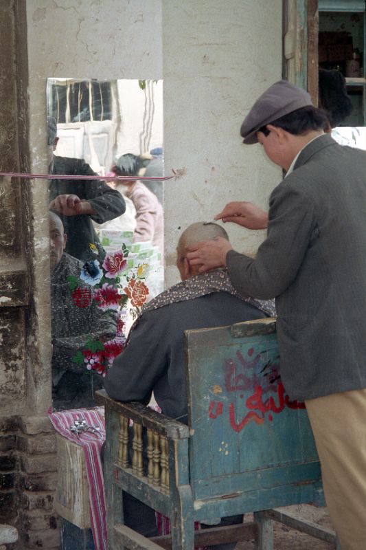 14 Kashgar Old City Street Scene 1993 Getting A Shaved Haircut